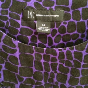 Purple/black giraffe print blouse.